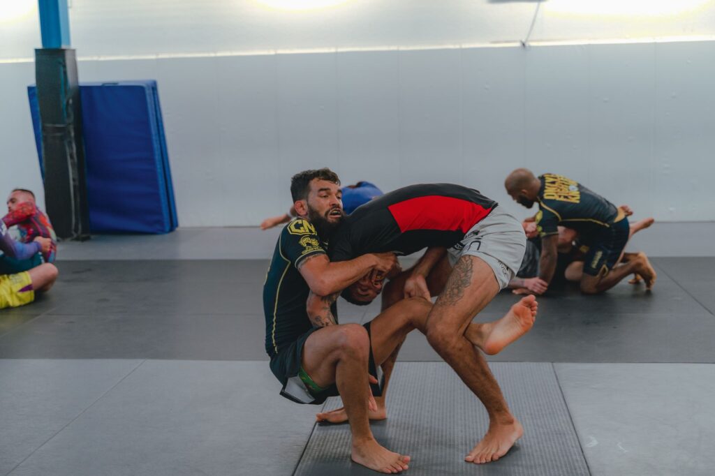 No-gi grapplers drilling from a front-headlock position