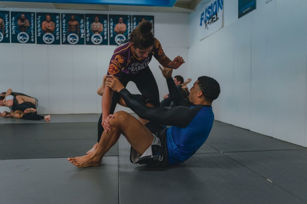 No-gi grapplers working from seated open guard