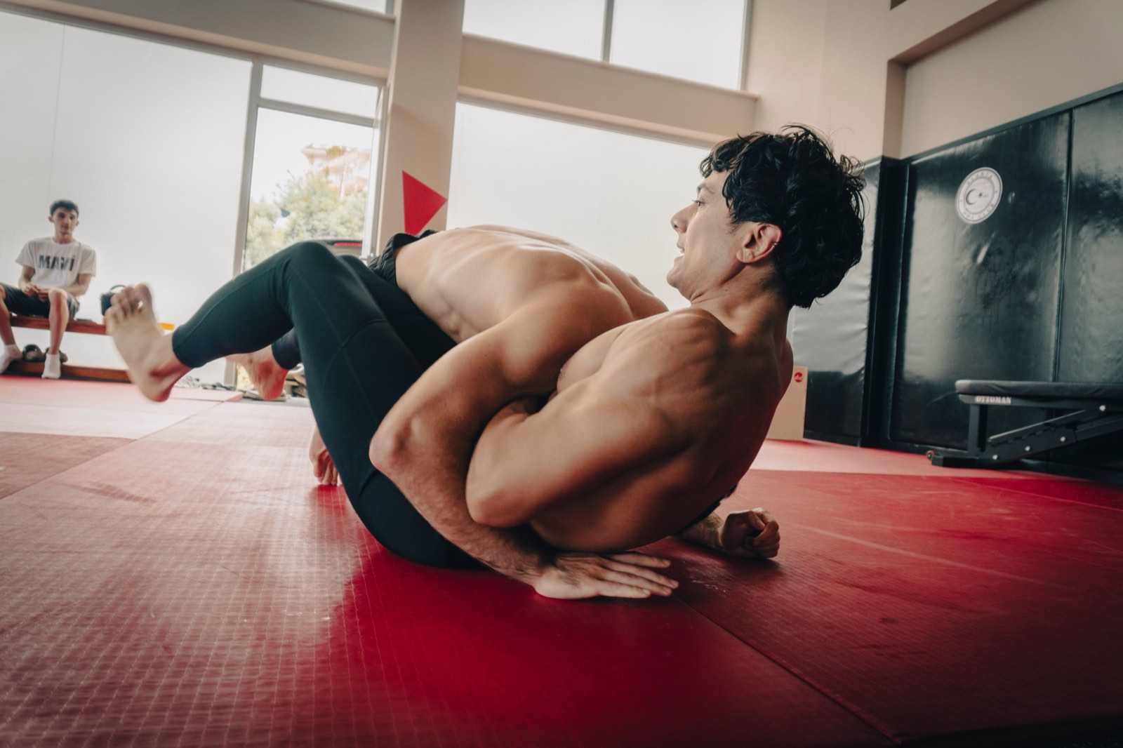 Grappler attacking a leg entanglement during no-gi training